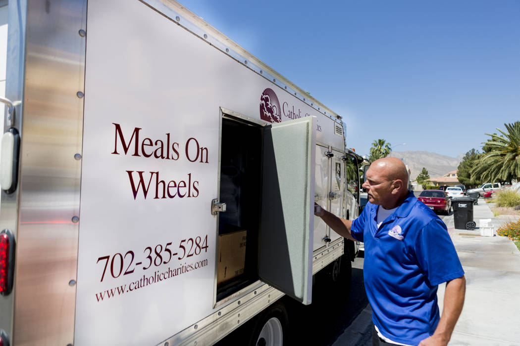 Meals on Wheels delivery driver Steve Ivan completes a delivery to Rafael Santiago-Figueroa at his home in Las Vegas, Thursday, May 25, 2017. Elizabeth Brumley Las Vegas Review-Journal @EliPagePhoto