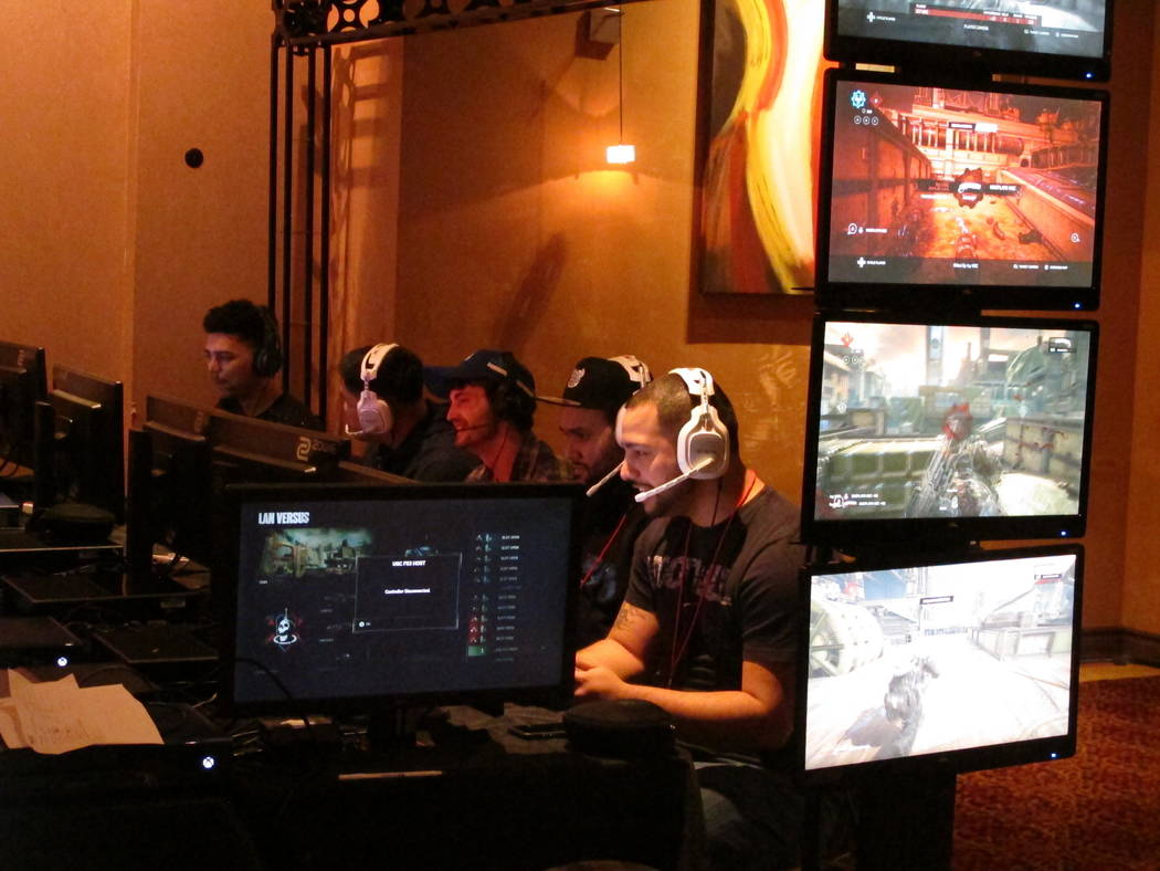 This March 31, 2017 photo shows a competitive video game tournament under way at Caesars casino in Atlantic City,N.J. Such games, called eSports, are one of several new interactive offerings that  ...