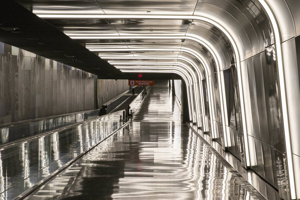 Light fixtures frame the recently completed 995-foot-long corridor linking the D-Gate Concourse to the airport’s U.S. Customs and Border Protection station in Terminal 3 at McCarran Interna ...