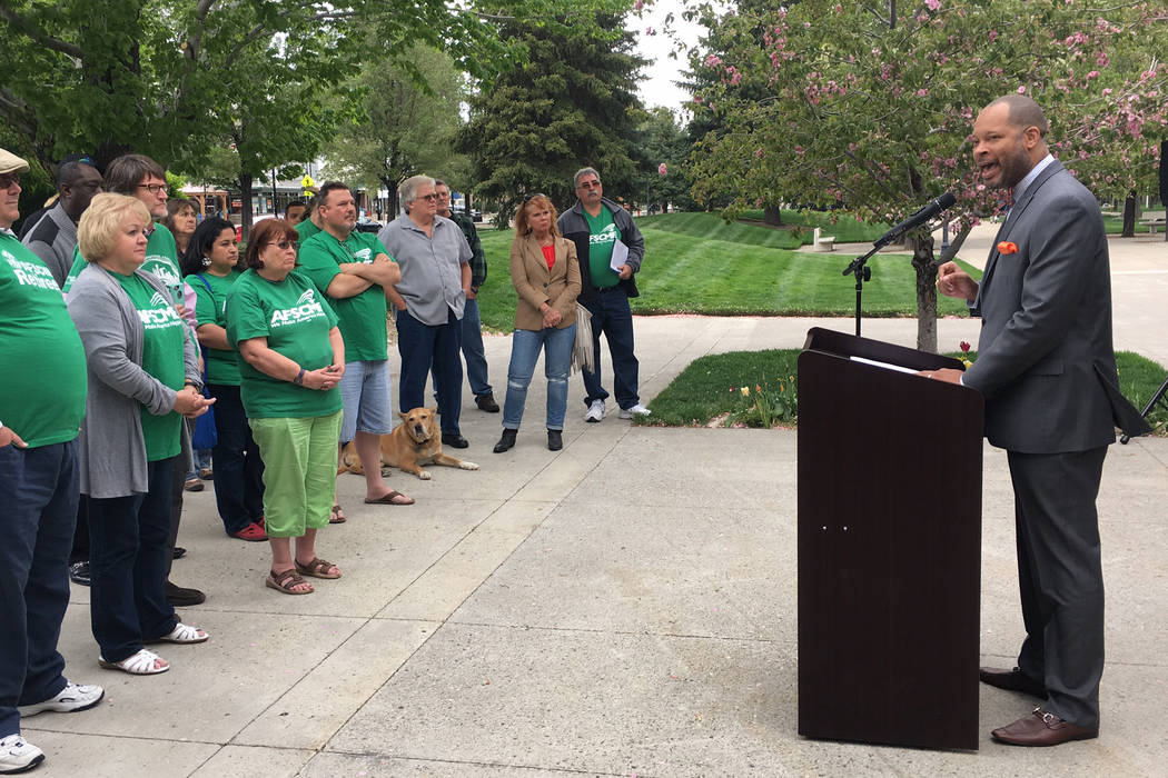 Senate Majority Leader Aaron Ford, D-Las Vegas, tells state workers he will work to help restore past wage cuts at a rally at the Nevada Legislature on Friday. Sean Whaley/Las Vegas Review-Journal