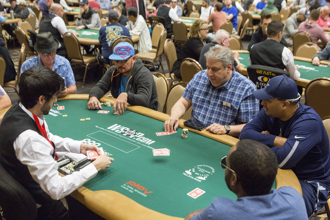 People play poker at the Rio Convention Center on Tuesday, May 30, 2017 in Las Vegas.  The 48th annual WSOP begins Wednesday and will continue for the following seven and a half weeks. Bridget Ben ...