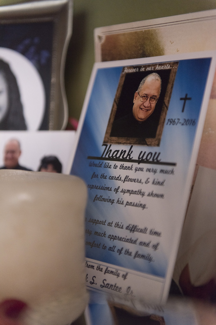 A card showing Mark Santee sits on a shelf at his daughter Amber Santee's residence in Henderson Monday, Aug. 15, 2016. Mark Santee was randomly killed while working as a security guard at a south ...
