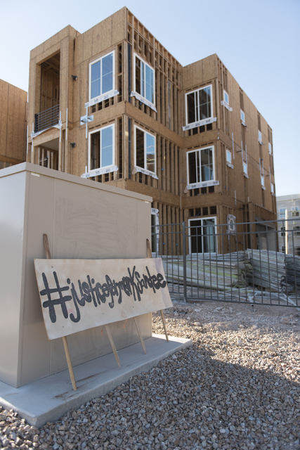 A sign calling for justice for Mark Santee is seen on Monday, Aug. 15, 2016. Santee was randomly killed while working as a security guard at a southwest valley construction site on April 27. Jason ...