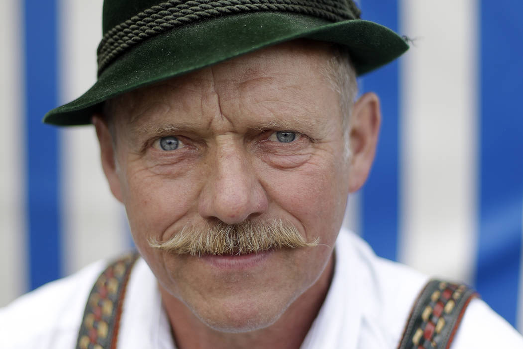 Georg Schoettl from Ohlstadt near Murnau looks into camera prior to his fight at the 40th Alpine Country Championships in Fingerhakeln in Woernsmuehl, Germany, Thursday, May 25, 2017. Competitors ...