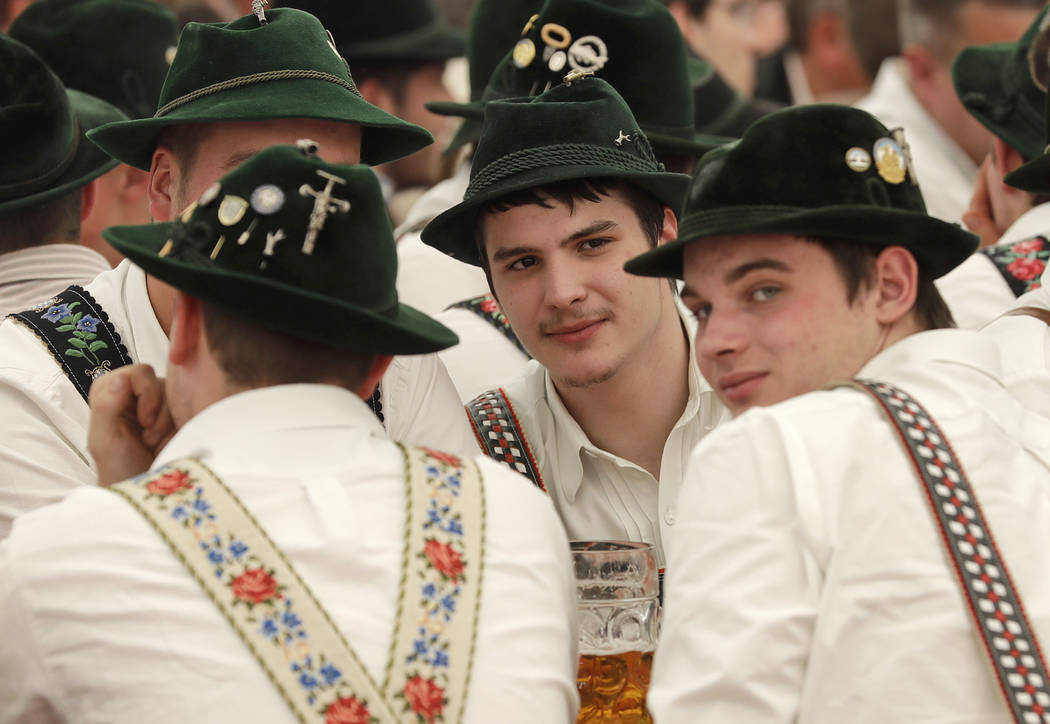 Young men dressed in traditional clothes attend the 40th Alpine Country Championships in Fingerhakeln_finger wrestling_ in Woernsmuehl, Germany, Thursday, May 25, 2017. Competitors battled for the ...