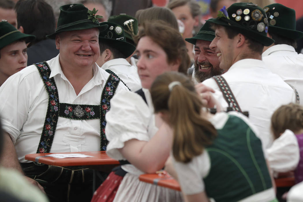 People dressed in traditional clothes attend the 40th Alpine Country Championships in Fingerhakeln_finger wrestling_ in Woernsmuehl, Germany, Thursday, May 25, 2017. Competitors battled for the ti ...