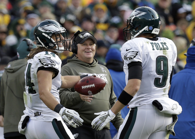 Philadelphia Eagles' Riley Cooper (14) is congratulated by Nick Foles (9) and head coach Chip Kelly Cooper's touchdown catch during the second half of an NFL football game against the Green Bay Pa ...