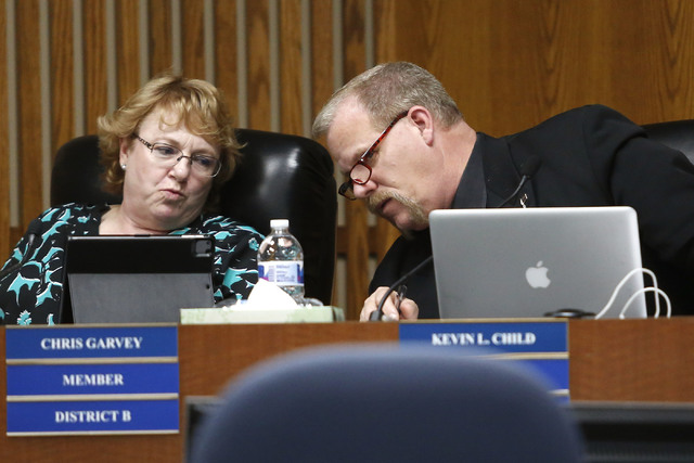 Clark County School Board Trustee Kevin L. Child, right, speaks to Chris Garvey during a board meeting at the Edward A. Greer Center on Thursday, Feb. 23, 2017, in Las Vegas. (Christian K. Lee/Las ...