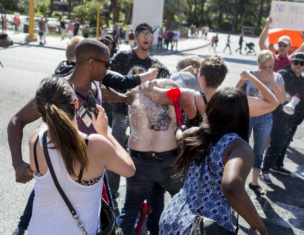 A fight breaks out while protesters block Las Vegas Boulevard in front of The Venetian to protest the officer involved death of Tashii Brown, in Las Vegas, Sunday, May 28, 2017. Elizabeth Brumley/ ...