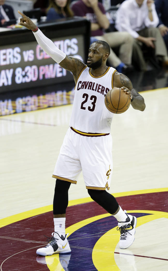Cleveland Cavaliers' LeBron James (23) brings the ball up the floor against the Boston Celtics during the second half of Game 4 of the NBA basketball Eastern Conference finals, Tuesday, May 23, 20 ...
