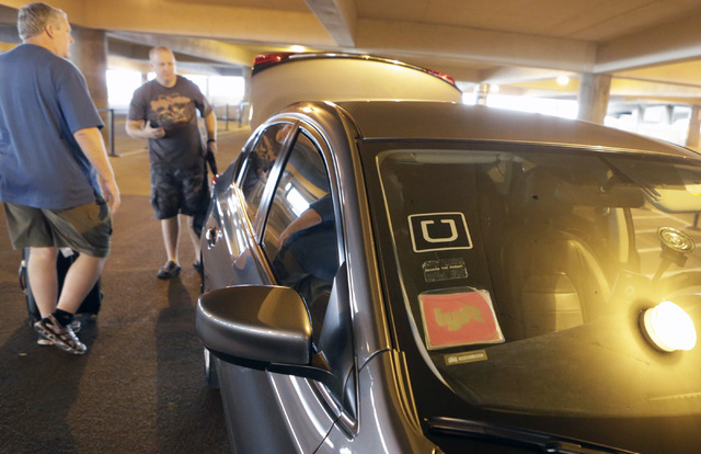 Riders prepare to load their luggage into Ride-hailing company's Uber and Lyft car at McCarran International Airport at Terminal 1 onThursday, Oct. 20, 2016. Bizuayehu Tesfaye/Las Vegas Review-Jou ...