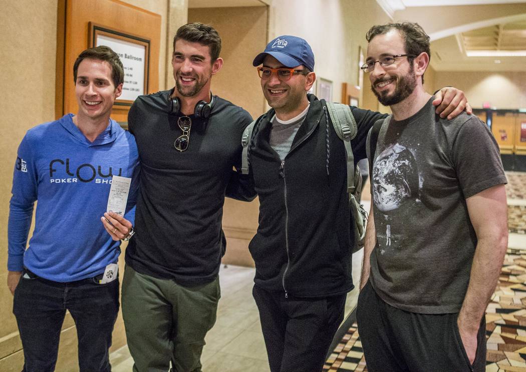 Olympic swimmer Michael Phelps with his team РJeff Gross, left, Antonio Esfandiari, center right, and Brian Rast Рbefore a tag team event in the opening of the World Series of Poker at ...
