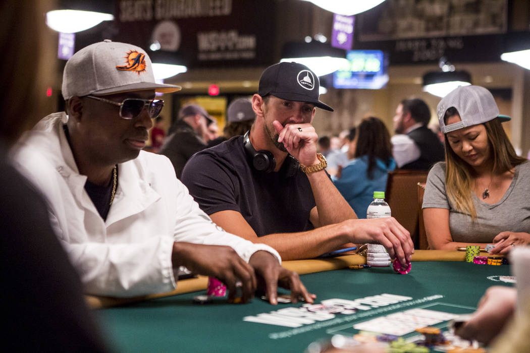Olympic swimmer Michael Phelps plays poker during a tag team event in the opening of the World Series of Poker at the Rio Convention Center on Wednesday, May 31, 2017. Patrick Connolly Las Vegas R ...
