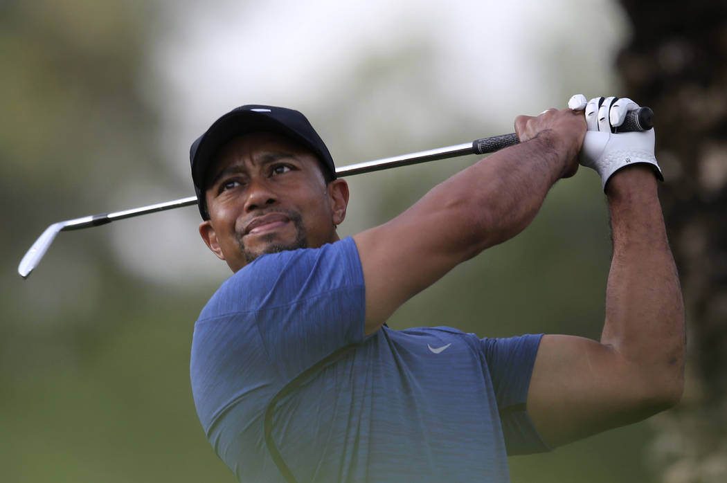 Tiger Woods tees off on the 11th hole during the first round of the Dubai Desert Classic golf tournament in Dubai, United Arab Emirates, Thursday, Feb. 2, 2017. (Kamran Jebreili/AP)