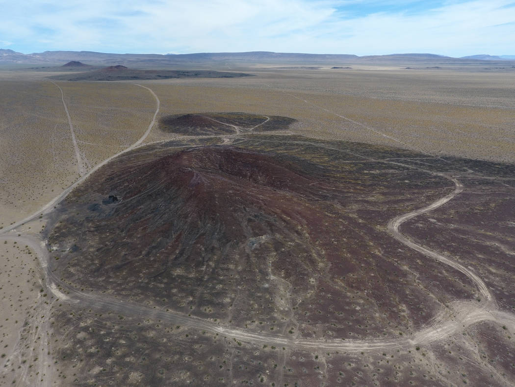 Little Cones, foreground, are two volcanic cinder cones that lie to the south of of Red Cone and Black cone, seen in the distance, in Crater Flat just west of Yucca Mountain, top center, on May 22 ...