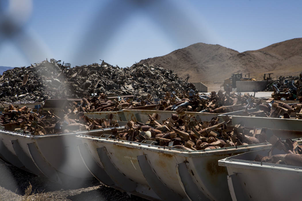 Piles of metal, formerly bombs and the vehicles they were dropped on, sit in bins at the Nevada Test and Training Range after being sorted and prepped to be sold as scrap metal. Patrick Connolly L ...