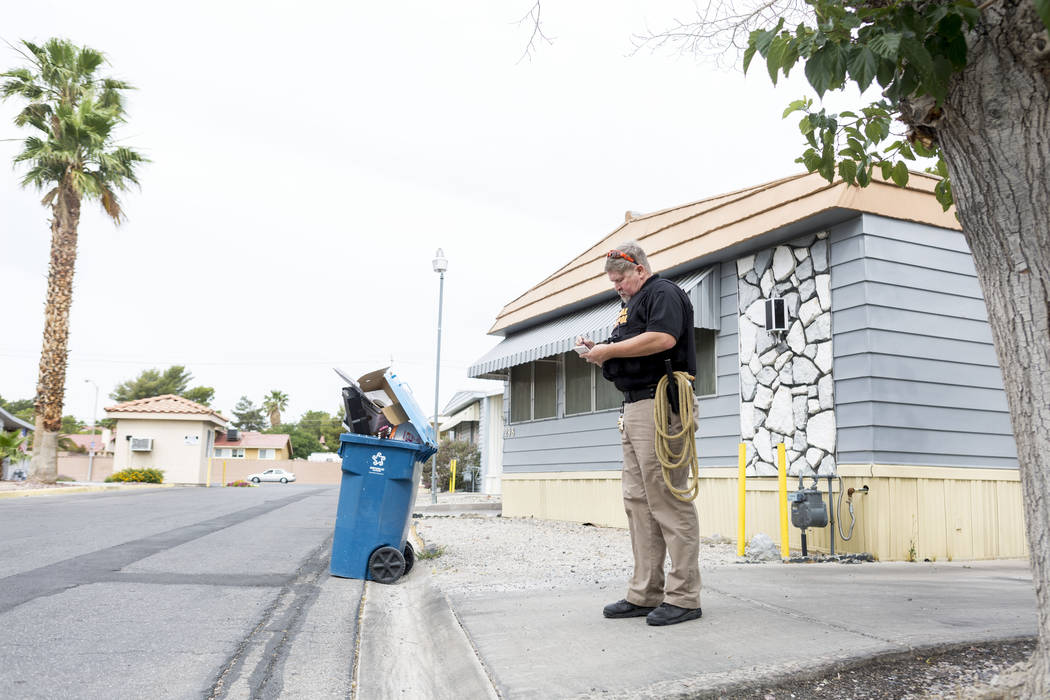 Animal control officer Mike Felton takes notes after responding to a report of a dog running loose in a mobile home park in Las Vegas, Wednesday, May 31, 2017. Elizabeth Brumley/Las Vegas Review-J ...