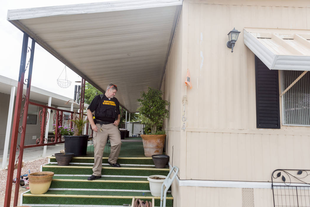 Animal control officer Mike Felton searches for a dog reportedly running loose in a mobile home park in Las Vegas, Wednesday, May 31, 2017.  Elizabeth Brumley/Las Vegas Review-Journal