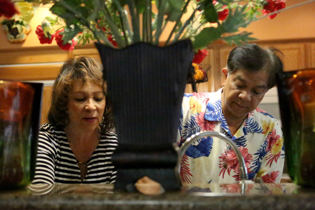 At their home on May 25, foster parents Renee, left, and Art Viray prepare dinner for the foster children that are in their care. Michael Quine/Las Vegas Review-Journal @Vegas88s