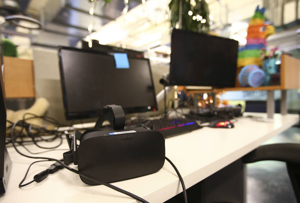 Call center desks with a virtual reality headset offer visitors a unique experience as part of the tour at Zappos headquarters in downtown Las Vegas on Thursday, June 1, 2017. Chase Stevens Las Ve ...