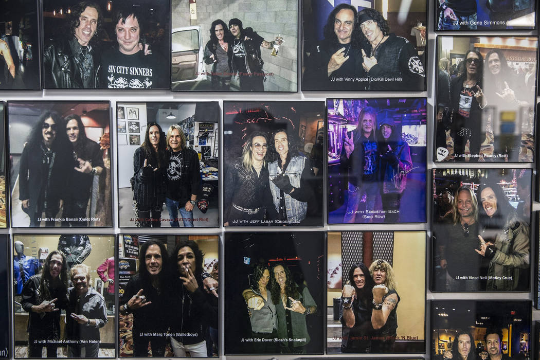 Barber J.J. Jones' Las Vegas salon is covered with photos he's taken with his favorite hair metal rockstars over the years. Photo taken on Wednesday, May 31, 2017, at Jones' salon, in Las Vegas. B ...