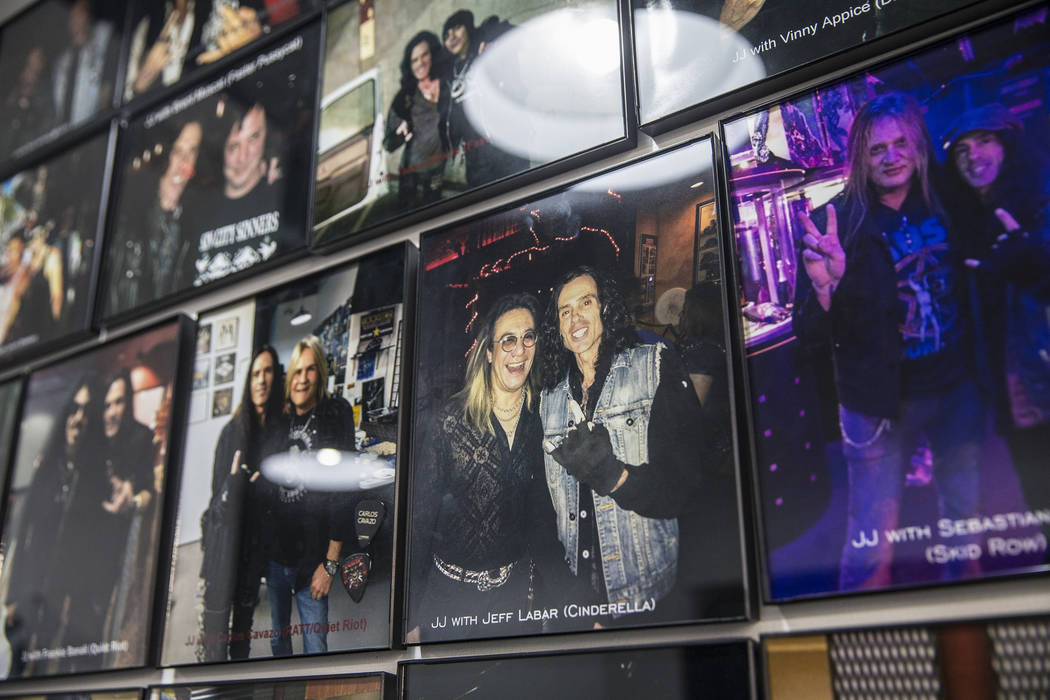 Barber J.J. Jones' Las Vegas salon is covered with photos he's taken with his favorite hair metal rockstars over the years. Photo taken on Wednesday, May 31, 2017, at Jones' salon, in Las Vegas. B ...