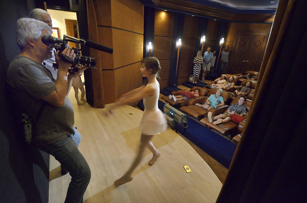 Director of photography Don Starnes films actress Grace O’Shaughnessy on the stage of a home studio during the making of a video to be used as a sales tool for the luxury home in the MacDon ...