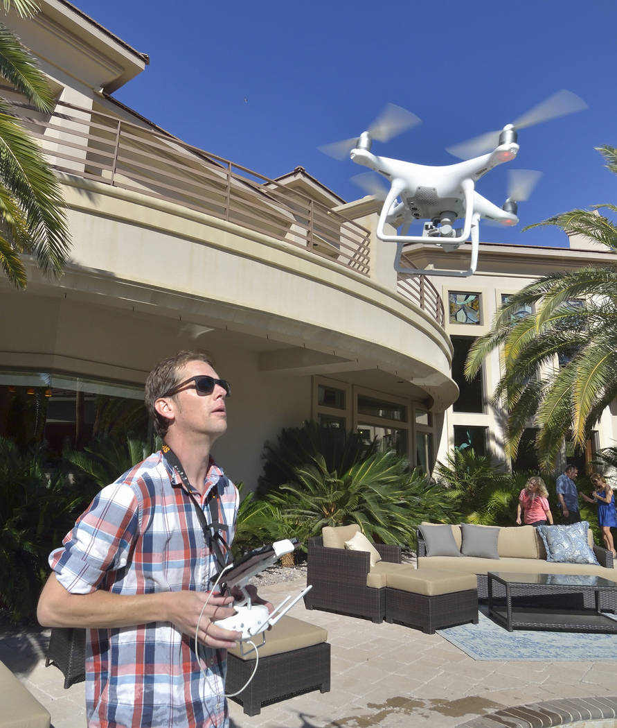 Bill Clary, owner of Got Aerial, pilots a drone during the making of a video to be used as a sales tool for a luxury home in the MacDonald Ranch community in Henderson on Saturday, May 13, 2017. ( ...
