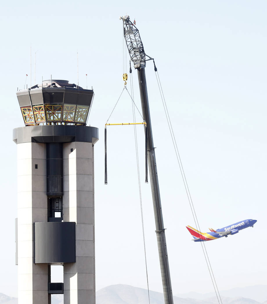 Workers prepare to lift a 525-square-foot cab from the top of the former air traffic tower at McCarran International Airport on Thursday, June 1, 2017, in Las Vegas. Bizuayehu Tesfaye Las Vegas Re ...