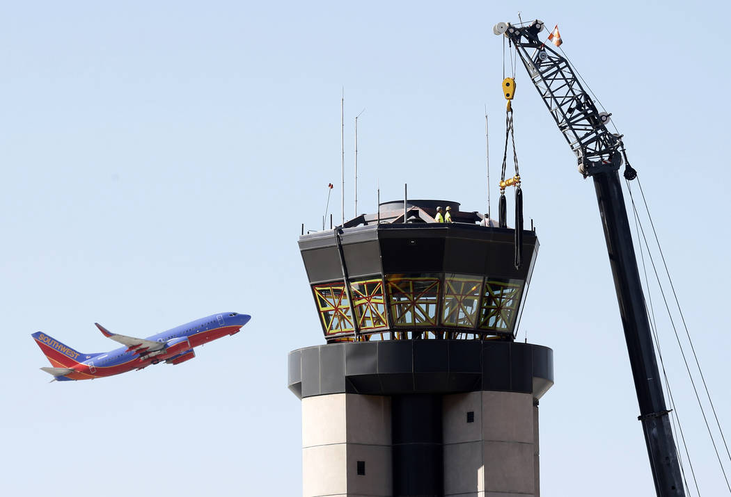 Workers prepare to lift a 525-square-foot cab from the top of the former air traffic tower at McCarran International Airport on Thursday, June 1, 2017, in Las Vegas. Bizuayehu Tesfaye Las Vegas Re ...