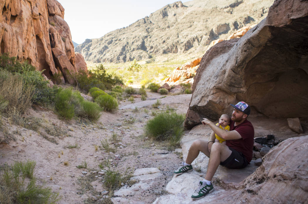 David Richards with his 9-month-old son Phoenix in the Whitney Pockets area of the Gold Butte National Monument south of Bunkerville on Friday, June 2, 2017. Chase Stevens Las Vegas Review-Journal ...