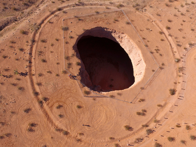 At approximately 100 ft. wide and 125 ft. deep, Devil’s Throat, is one of the largest known sink holes in Gold Butte National Monument as seen from the air on Tuesday, January 17, 2017. (Mi ...