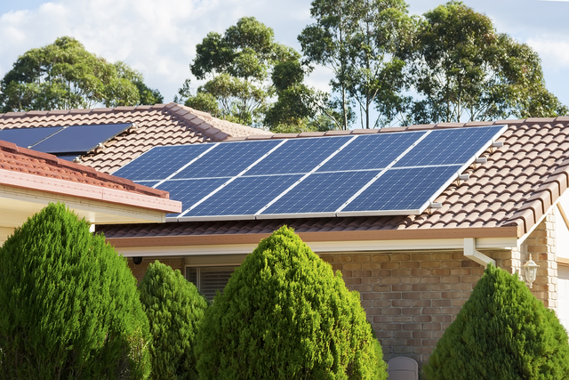 Photovoltaic panels like the ones on this home’s rooftop generate electric power by using solar cells to convert energy from the sun. (Thinkstock)