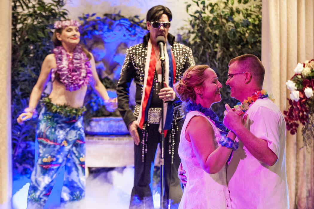 Ron Decar, owner of Viva Las Vegas, makes his appearance as Elvis as Missie Berry and Robert Moseley renew their wedding vows at the Viva Las Vegas Wedding Chapel on Saturday, June 3, 2017.  Patri ...
