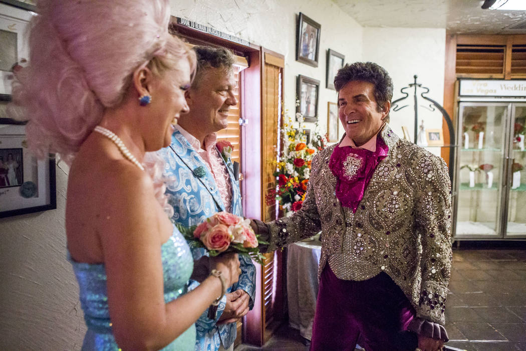 Liberace greets Andrea Cambridge and Chuck Varga before their wedding ceremony at the Viva Las Vegas Wedding Chapel on Saturday, June 3, 2017.  Patrick Connolly Las Vegas Review-Journal @PConnPie