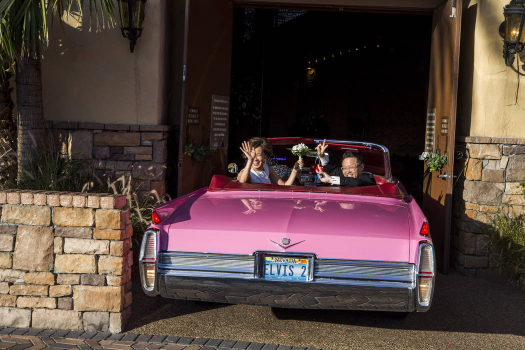 Garry and Julie Kim leave the chapel in a pink Cadillac after renewing their wedding vows at the Viva Las Vegas Wedding Chapel on Saturday, June 3, 2017.  Patrick Connolly Las Vegas Review-Journal ...