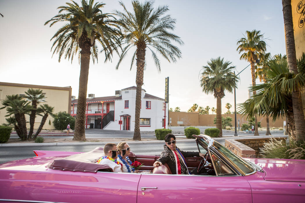 Ron Decar, owner of Viva Las Vegas and dressed as Elvis, drives Missie Berry and Robert Moseley into the chapel to renew their wedding vows at the Viva Las Vegas Wedding Chapel on Saturday, June 3 ...