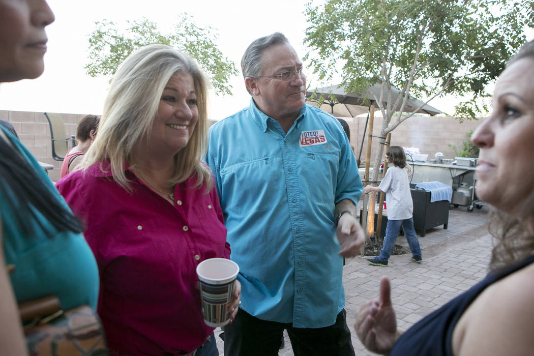 Las Vegas Ward 6 city council candidate Kelli Ross, left, and husband Steve Ross, who currently represents Ward 6, right, entertain family, friends and campaign workers during a watch party at the ...
