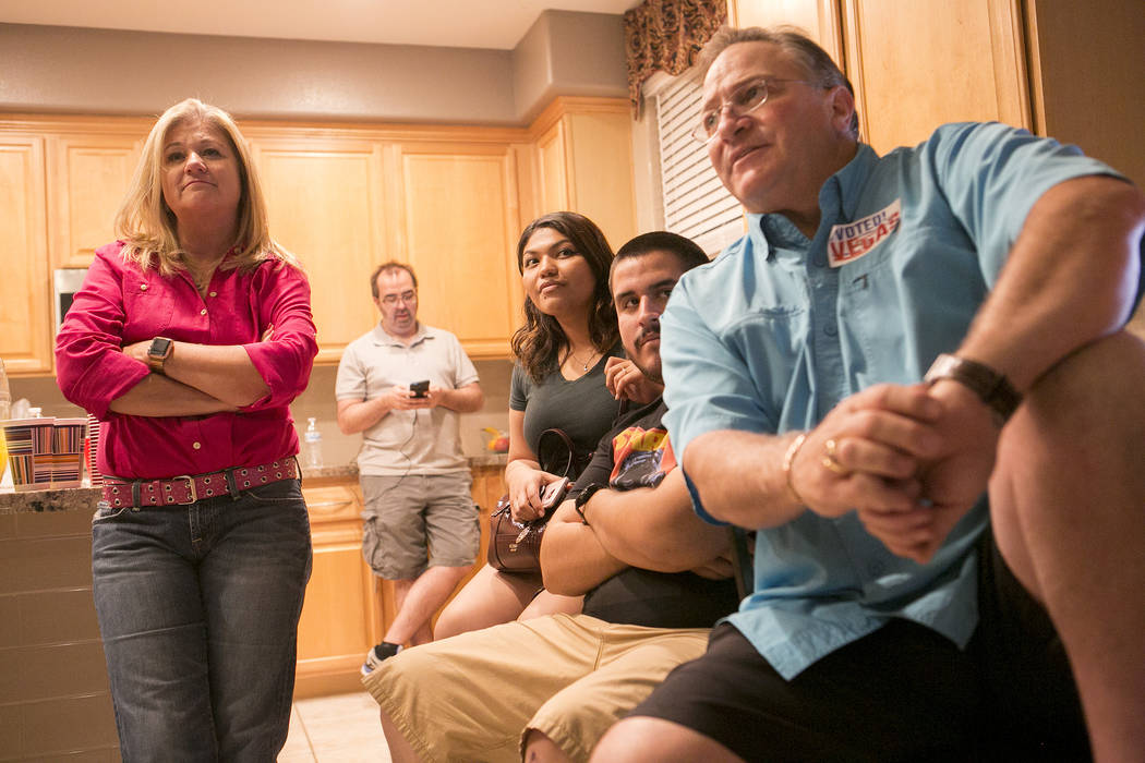 Las Vegas Ward 6 City Council candidate Kelli Ross, left, watches voting results roll in during a watch party at her home on Tuesday, June 13, 2017 in Las Vegas. Bridget Bennett Las Vegas Review-J ...