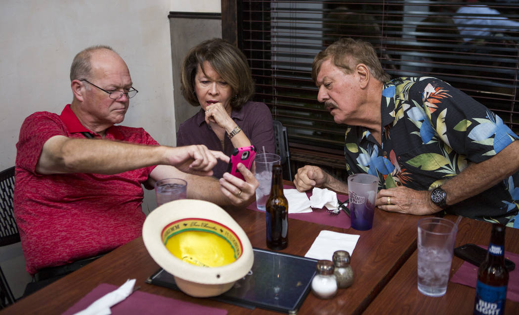 Councilman Bob Beers looks at election results with friends Martha and Mike Kimpel at Lola's - A Louisiana Kitchen in Summerlin on Tuesday, June 13, 2017. Patrick Connolly Las Vegas Review-Journa ...