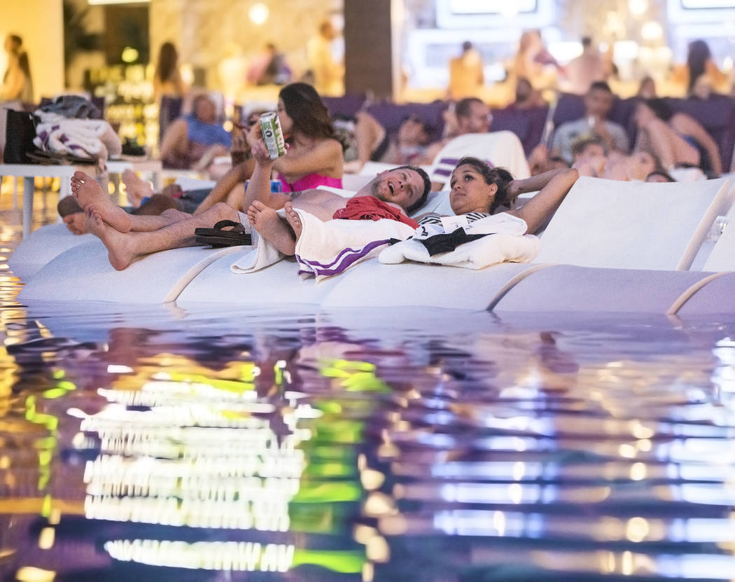 Poolgoers enjoy a showing of "Happy Gilmore" during Dive In Movies at Boulevard Pool at the Cosmopolitan Las Vegas on Monday, June 5, 2017. (Benjamin Hager Las Vegas Review-Journal) @benjaminhphoto
