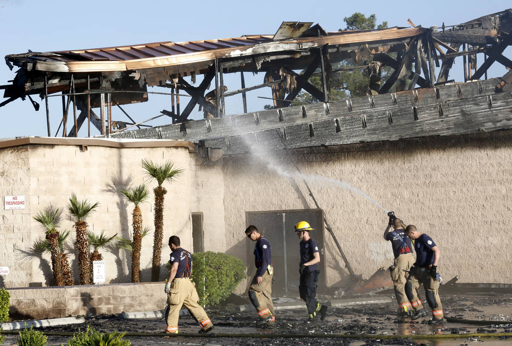 North Las Vegas firefighters spray water on Zion United Methodist Church, 2108 Revere St., which was reported on fire about 1 a.m. Tuesday, June 6, 2017. (Bizuayehu Tesfaye/Las Vegas Review-Journa ...