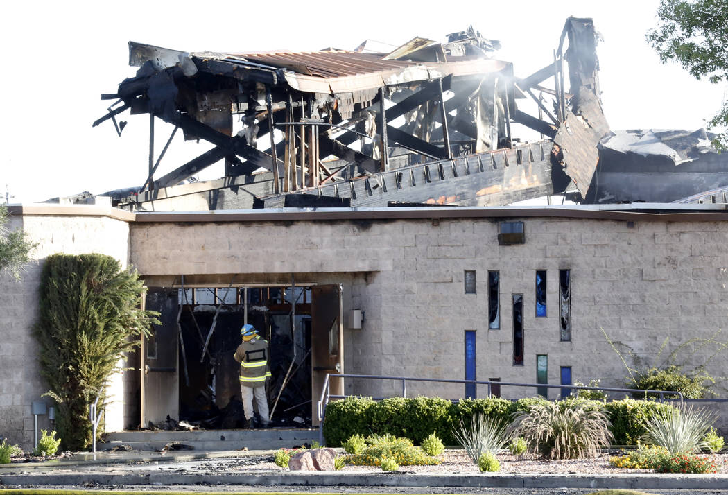 An agent with the Bureau of Alcohol, Tobacco, Firearms and Explosives investigates a fire at Zion United Methodist Church, 2108 Revere St., on Tuesday, June 6, 2017. (Bizuayehu Tesfaye/Las Vegas R ...