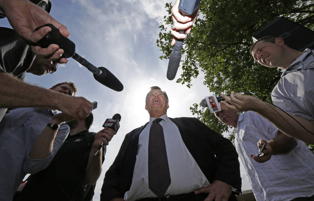 Tim Leiweke, center, CEO of the Oak View Group, talks to reporters following a news conference, Wednesday, June 7, 2017, in front of KeyArena in Seattle. Seattle Mayor Ed Murray said Wednesday tha ...