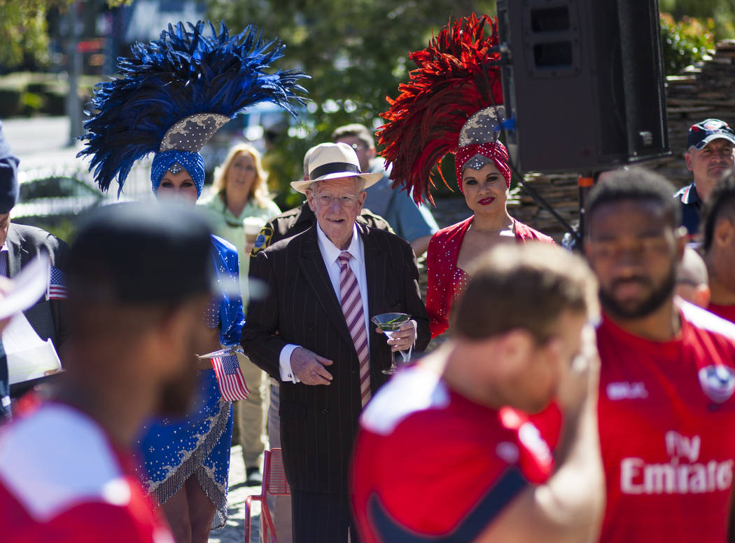 Former Mayor Oscar Goodman, lower right, looks on with his showgirls during a pep rally ahead of the USA Sevens International Rugby Tournament at the Monte Carlo on the Las Vegas Strip on Wednesda ...