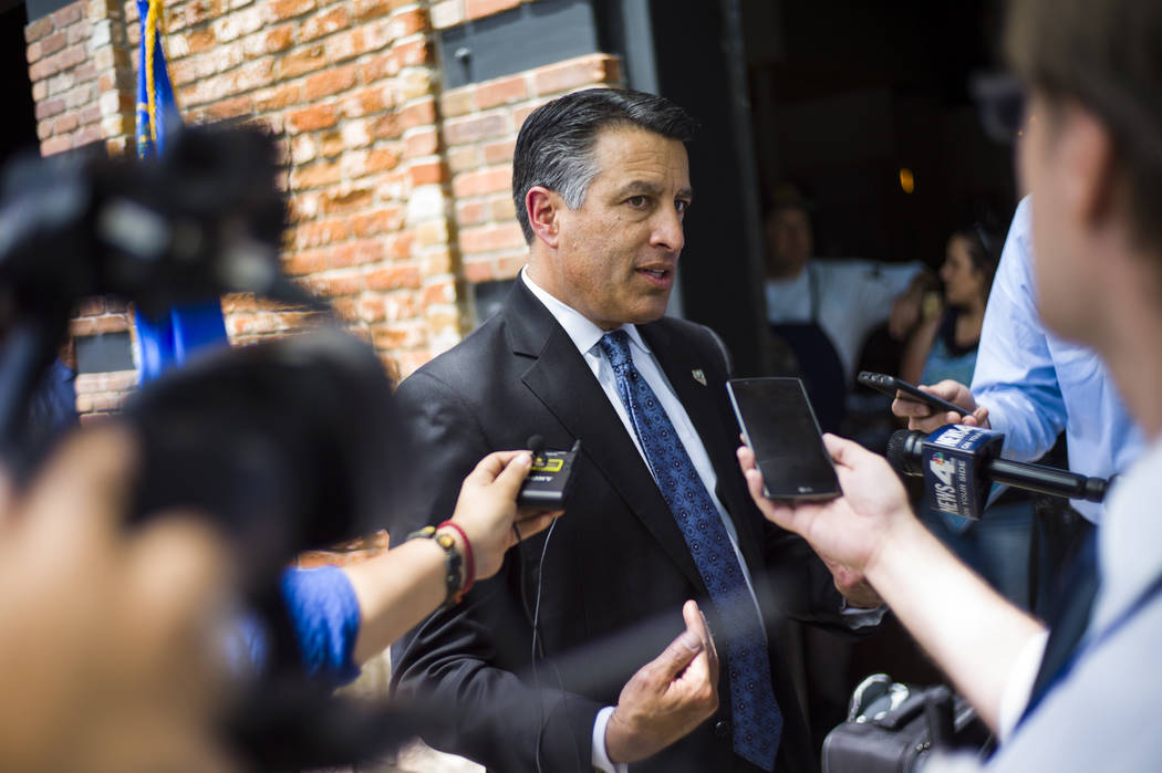 Gov. Brian Sandoval talks with reporters at The Union restaurant and brewery in Carson City on Monday, June 5, 2017. (Chase Stevens Las Vegas Review-Journal) @csstevensphoto