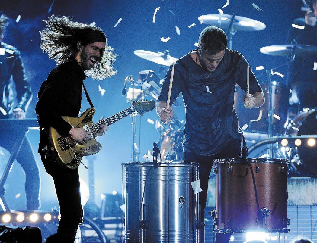 Wayne Sermon, left, and Dan Reynolds, of the musical group Imagine Dragons, perform on stage at the Billboard Music Awards at the MGM Grand Garden Arena on Sunday, May 18, 2014, in Las Vegas. (Pho ...