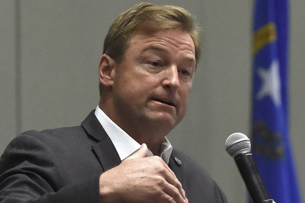Nevada Sen. Dean Heller answers a question during a town hall at the Reno Sparks Convention Center in Reno, Nev. on April 17, 2107.  (Andy Barron/Reno Gazette Journal via AP)