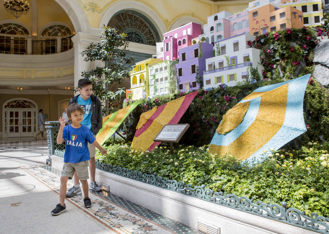 Matthew Reginaldo, 12, and West Tucker, 4, both from San Diego, visit the new Italian-inspired display at Bellagio's Conservatory & Botanical Gardens on Monday, June 12, 2017.  Patrick Connoll ...