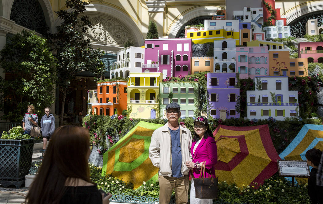Rue Duong, right, and Hong Tran of Anaheim, Calif. stand together for a photo during the opening of the new Italian-inspired display at Bellagio's Conservatory & Botanical Gardens on Monday, J ...